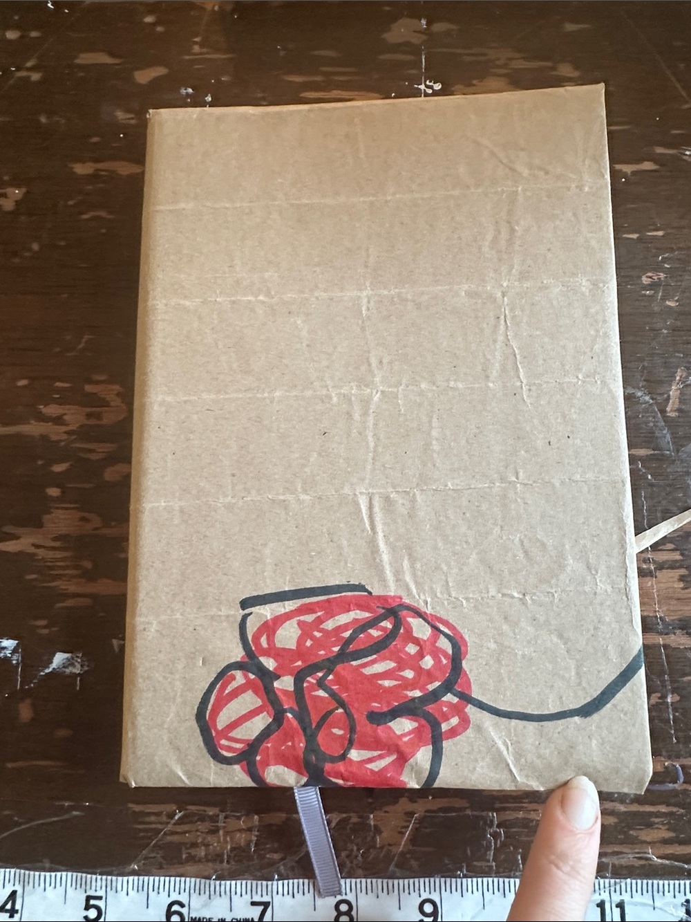 8.5” by 6” art covered lined journal with ribbon bookmark